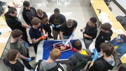 Stop the Bleed Training - Students using gauze with fake blood being pushed through to simulate the process.